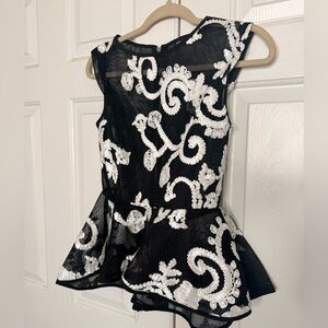 Never worn Black and White Peplum blouse